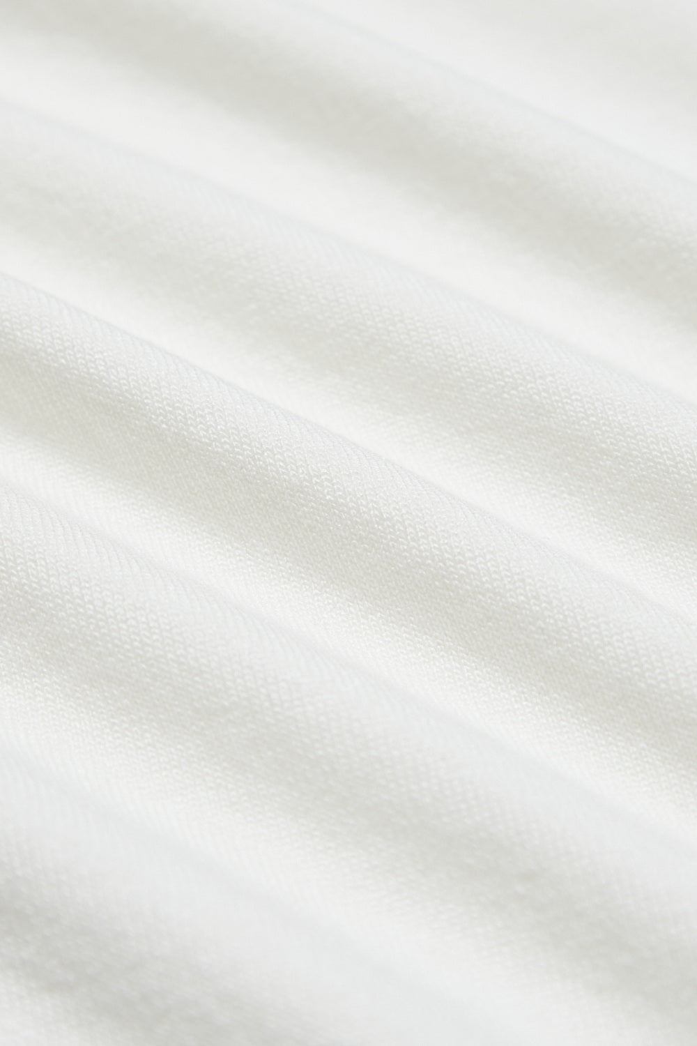 微斜下襬背心式針織上衣-白