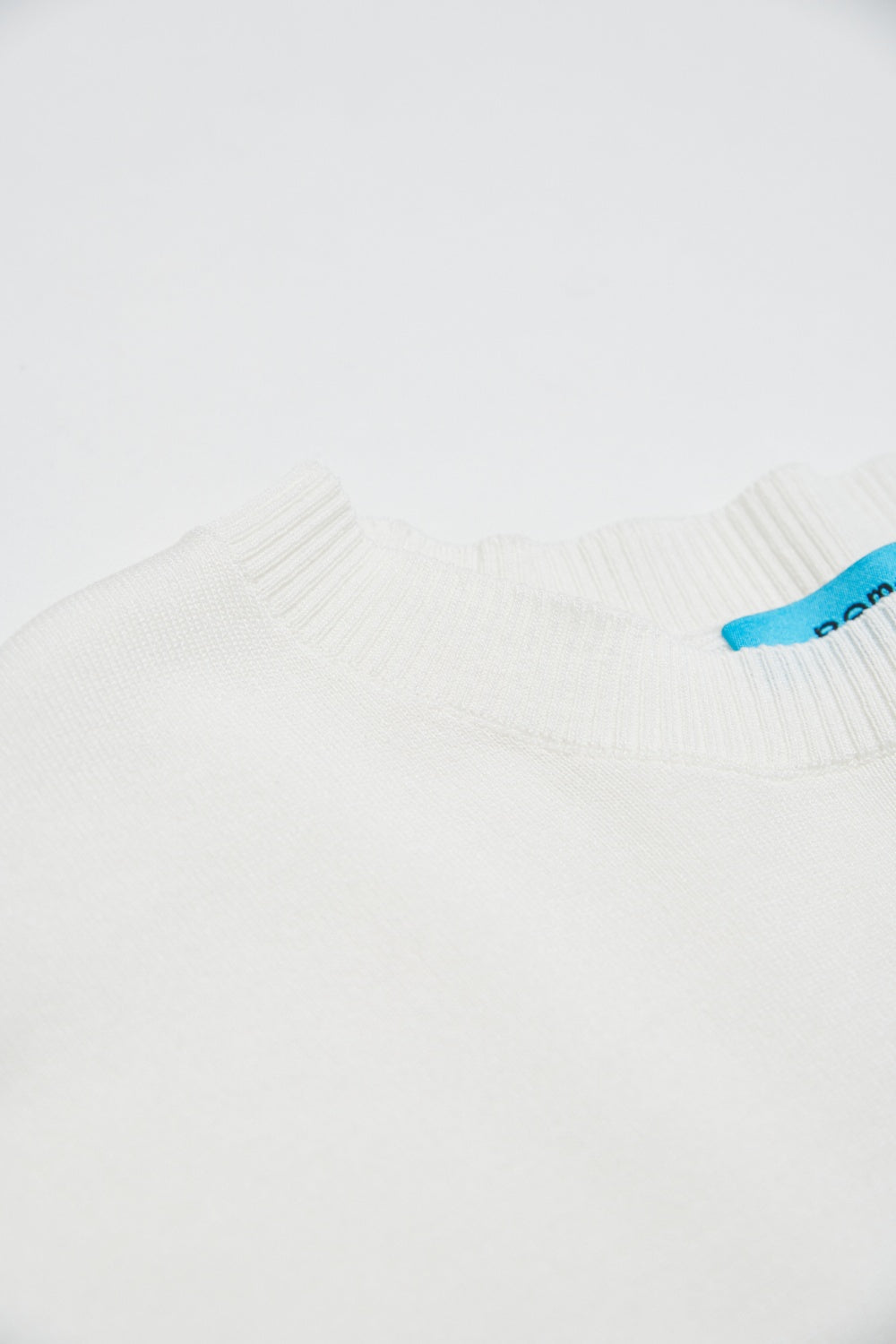 素面捲邊寬鬆長版針織五分袖上衣-白