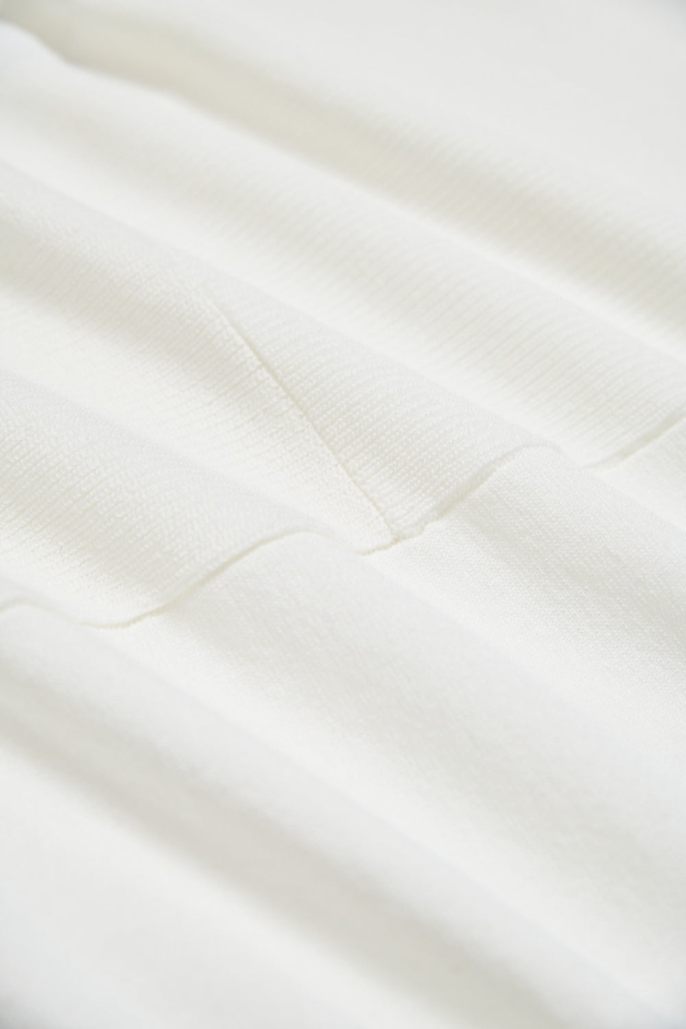 素面捲邊寬鬆長版針織五分袖上衣-白